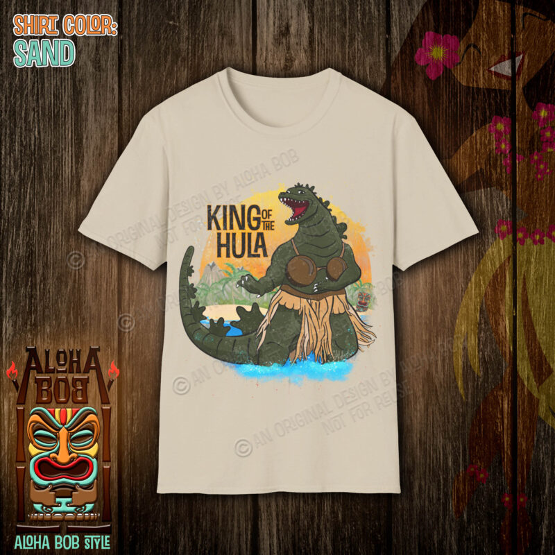 Embark on a wild fusion of kaiju power and tiki charm with the "Godzilla - King of the Hula" tee by Aloha Bob.